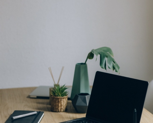 Free Black Laptop Computer On Brown Wooden Table Stock Photo