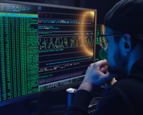 Free A Man Looking at a Computer Screen with Data Stock Photo