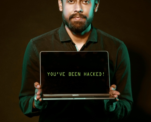 Free Man Holding Laptop Computer With Both Hands Stock Photo