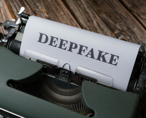 Free A typewriter with the word deepfake on it Stock Photo